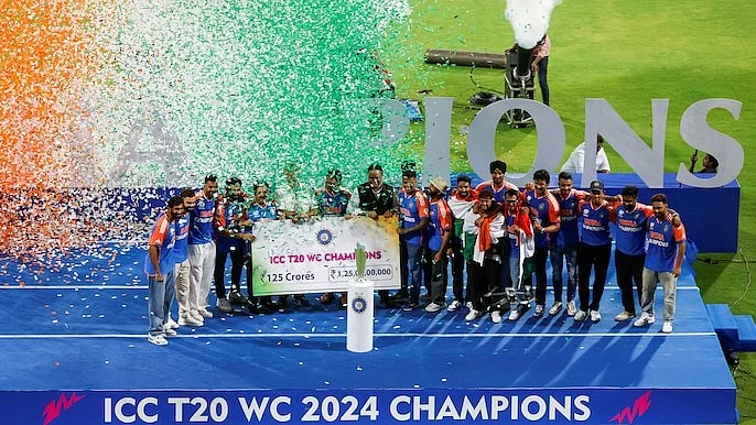 Team India pose with the BCCI prize money of Rs 125 crores at Wankhede (photo: @BCCI/X)