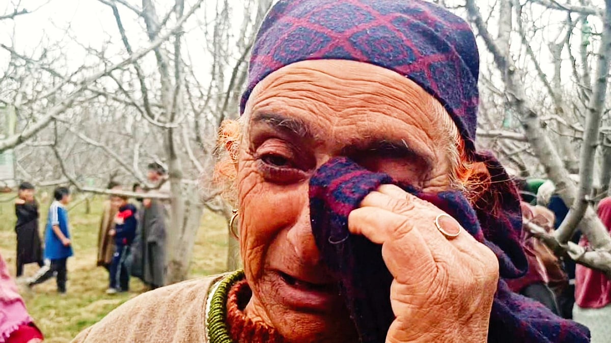 A tearful woman from Shopian mourns the possible loss of her orchard