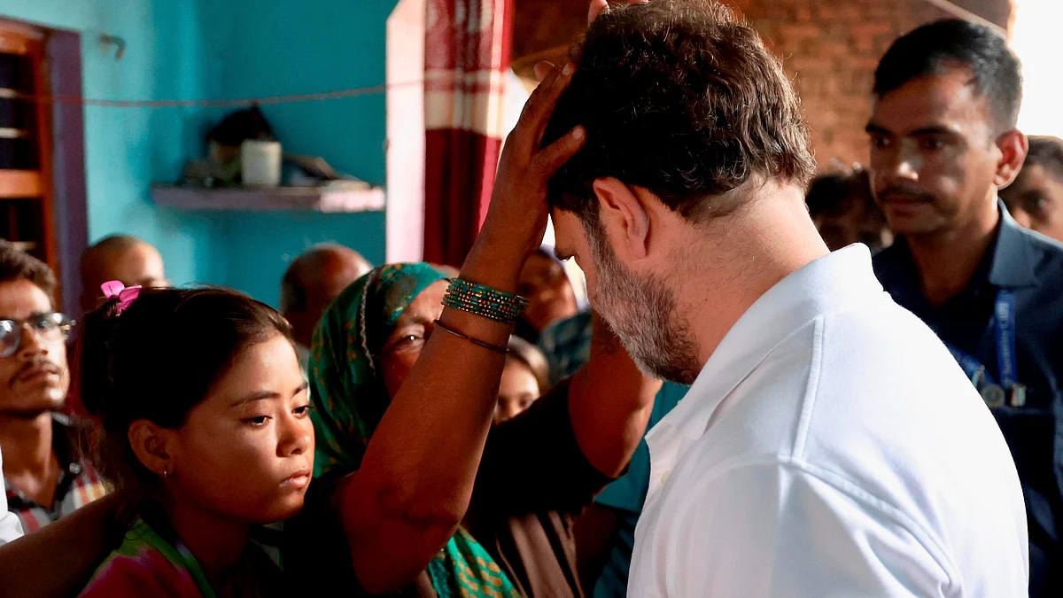 Rahul Gandhi meets kin of the victims in Pilkhana village of Aligarh (photo: PTI)