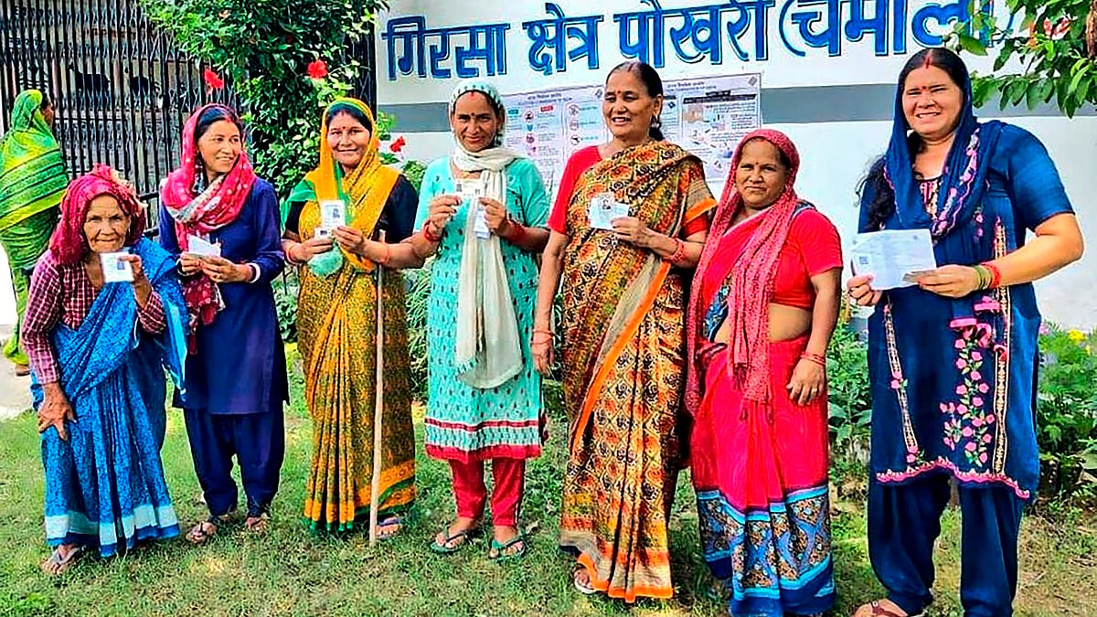 Chamoli: Women show their fingers marked with indelible ink after casting vote (photo: PTI)