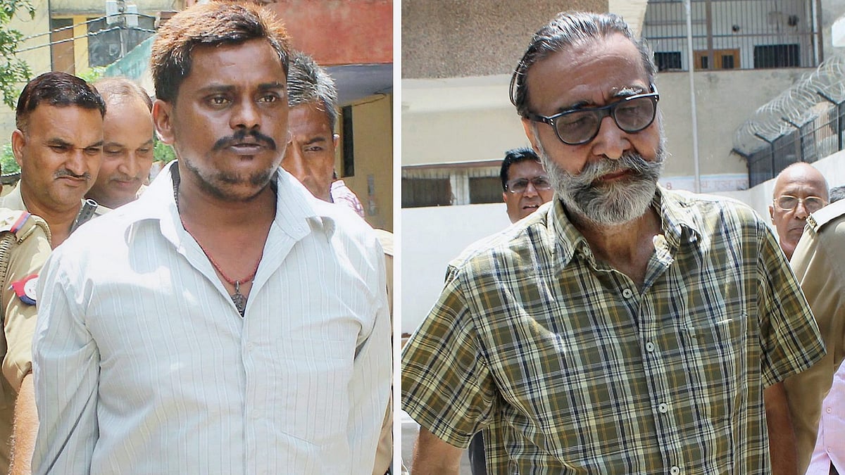 Surendra Koli (L) and Mohinder Pandher being taken to jail on 16 October (photo: PTI)