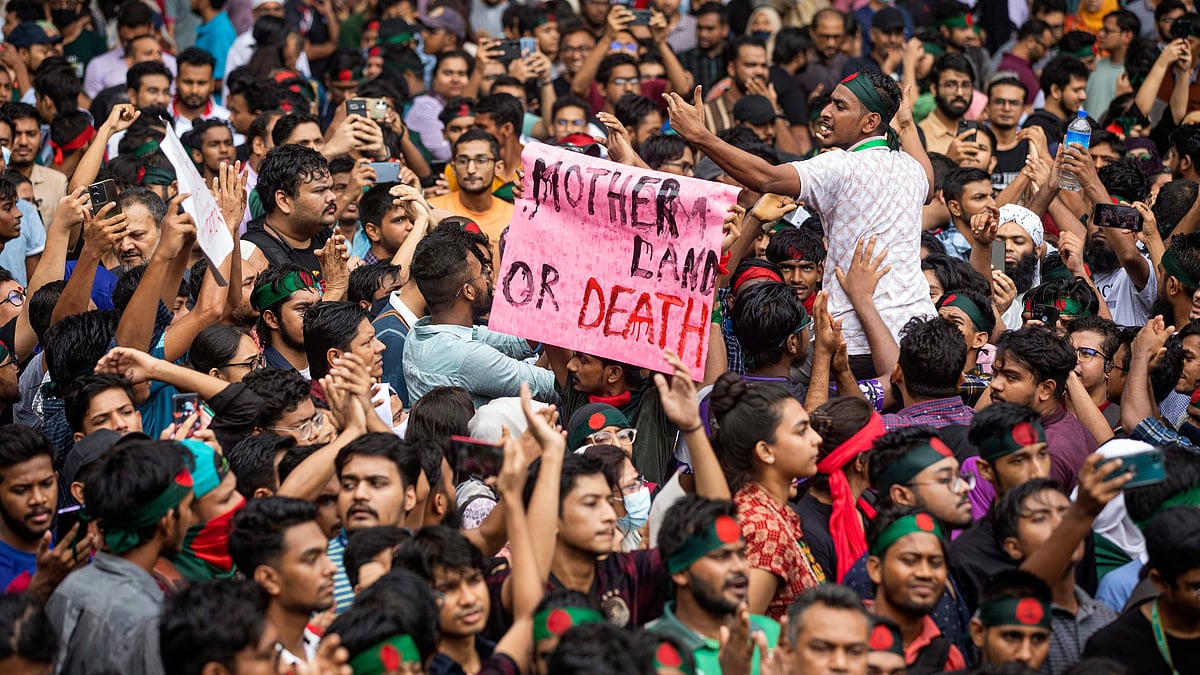 People participate in a protest march in Dhaka on 3 August (photo: PTI)