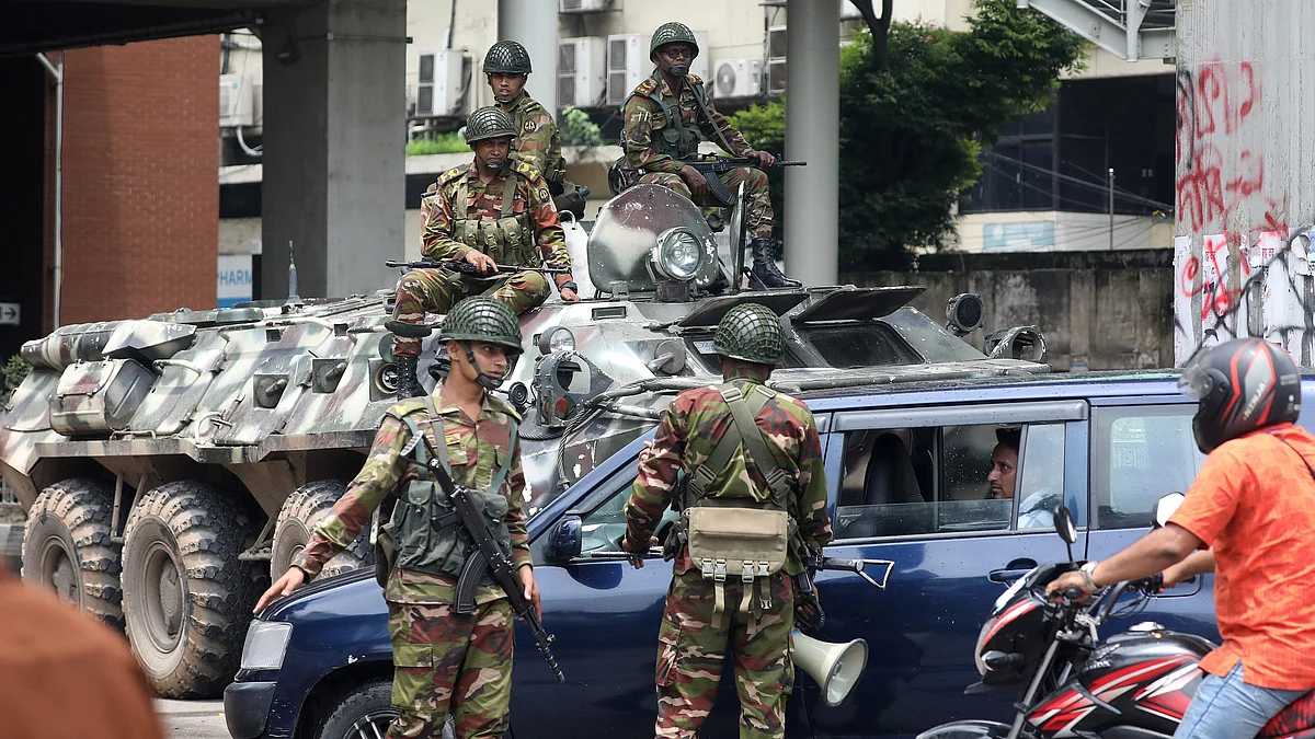 Bangladeshi soldiers patrol Dhaka after the government imposed a new curfew (photo: PTI)