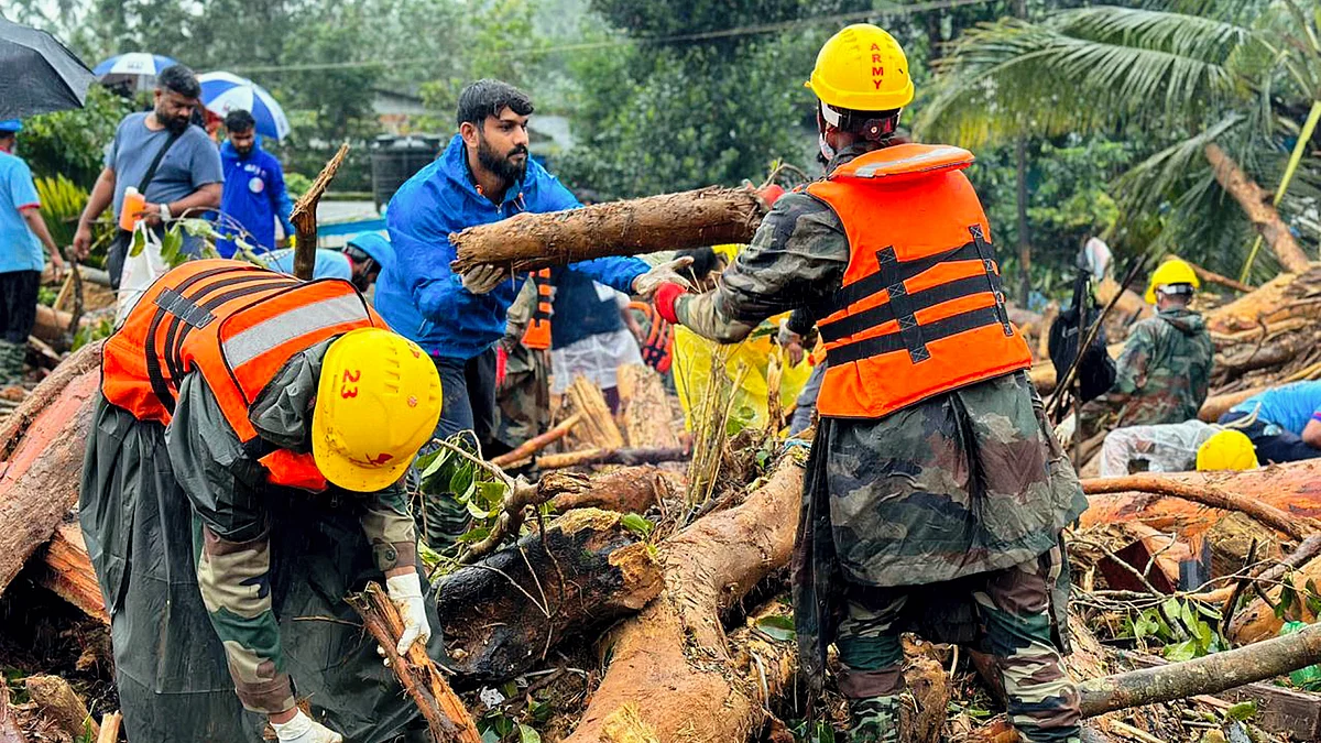 Rescue personnel remove debris from the landslides in Wayanad district (photo: PTI)