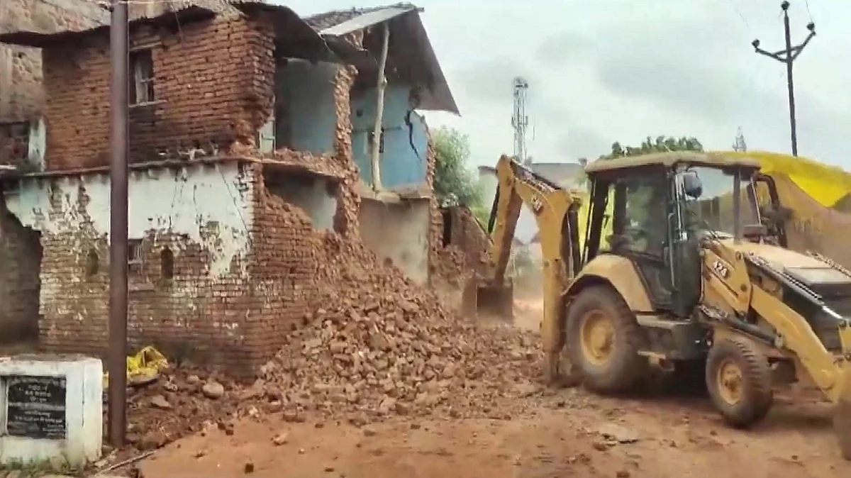 Rescue work underway after the wall collapsed in Sagar on 4 August (photo: PTI)