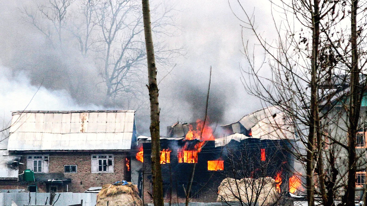Houses burn during gunfights between militants and security forces in Pulwama