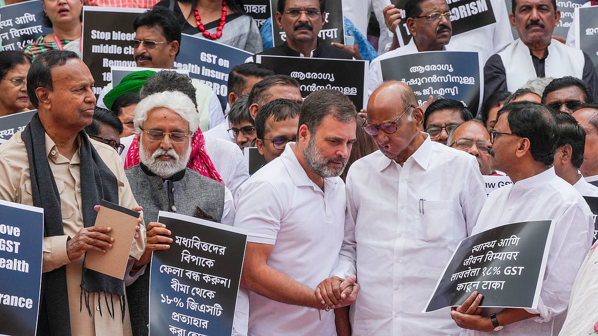 Opposition participate in a protest demanding removal GST from health/medical insurance