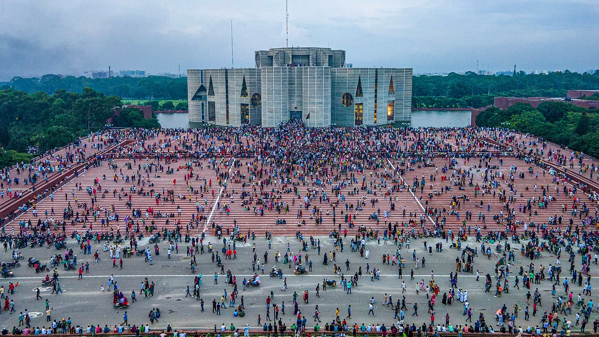 A photo taken with a drone shows people gather around at the Bangladesh Parliament House in Dhaka