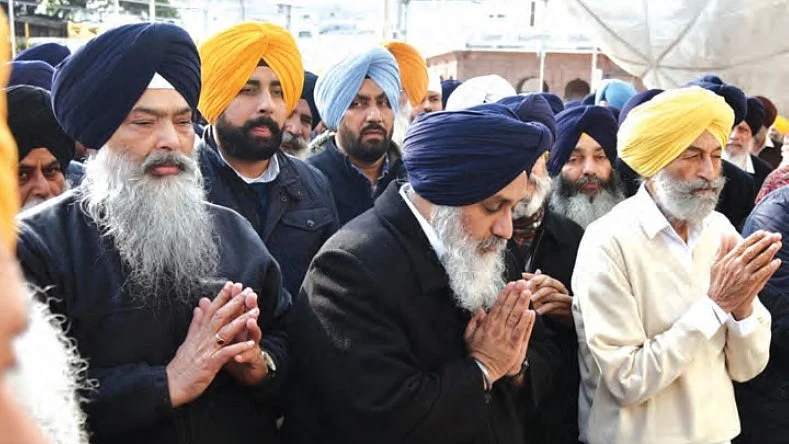File photo of Sukhbir Singh Badal (centre) at the Golden Temple in Amritsar (photo: NH Archives)