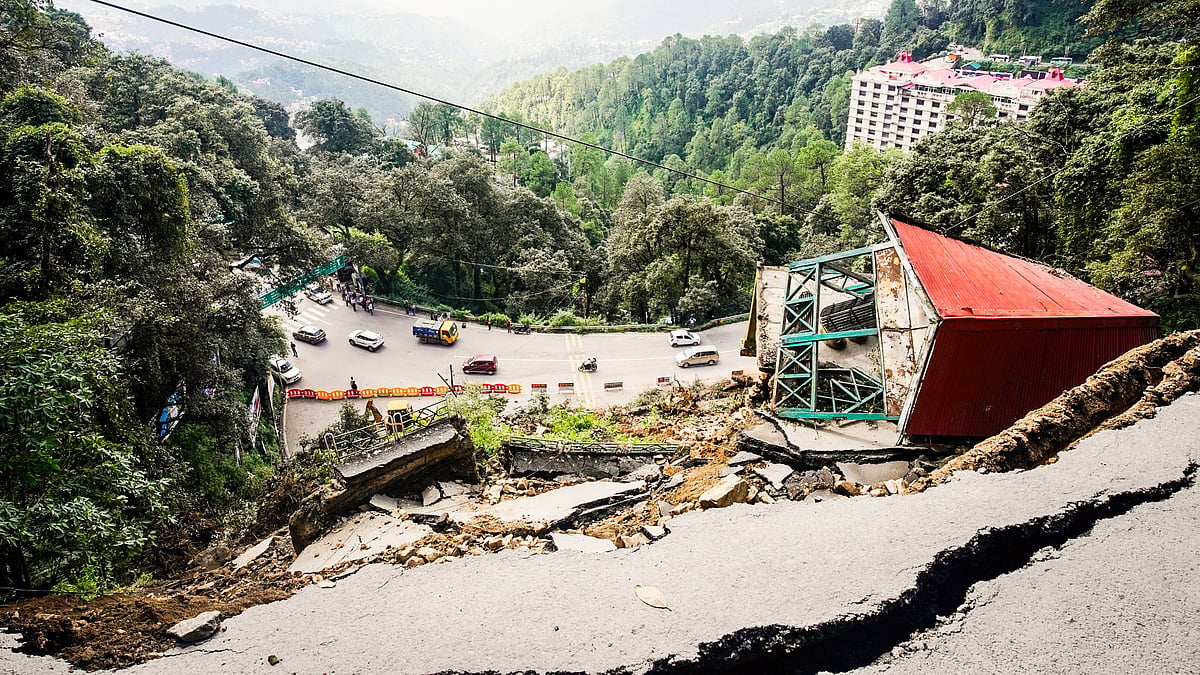 A road damaged by a massive landslide at Baluganj, in Shimla (photo: PTI) 