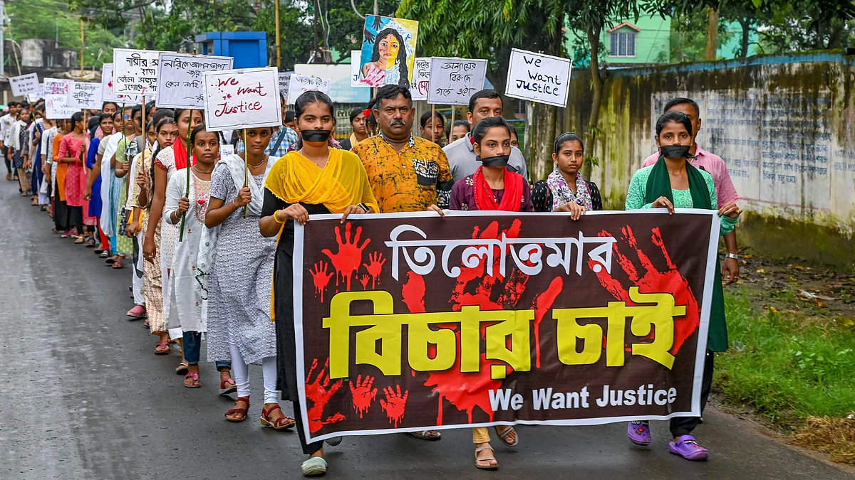 People participate in protest rally in Nadia on 22 August (photo: PTI)
