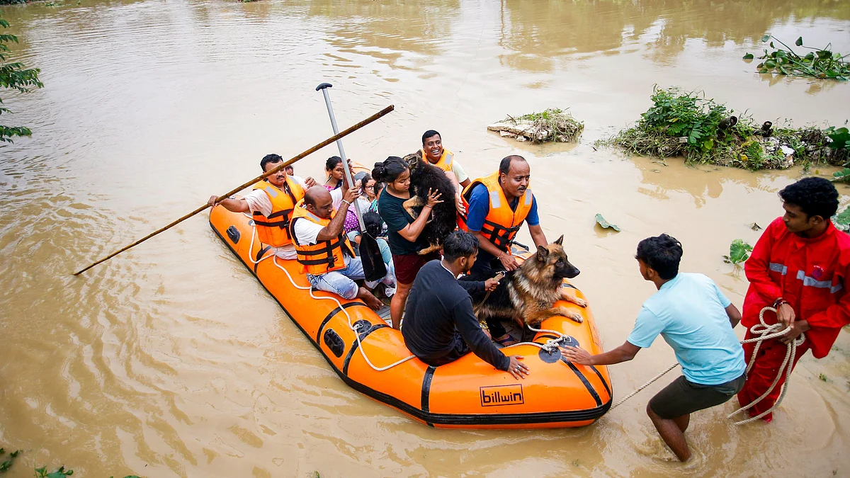 Disaster management authority evacuate people in Agartala on 22 August (photo: PTI)