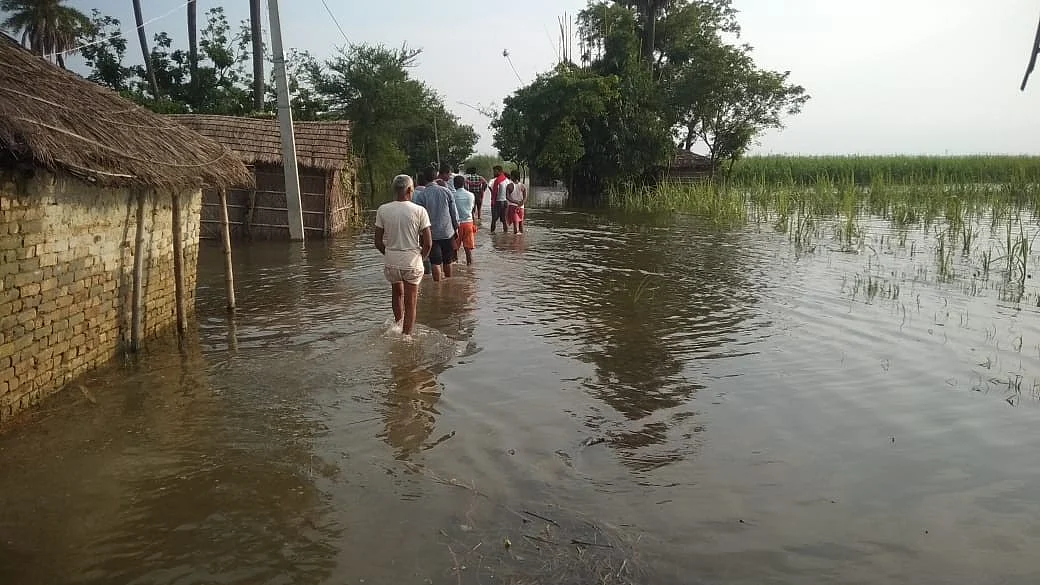 People wade through flooded streets in Bhagalpur on 5 September (photo: IANS)