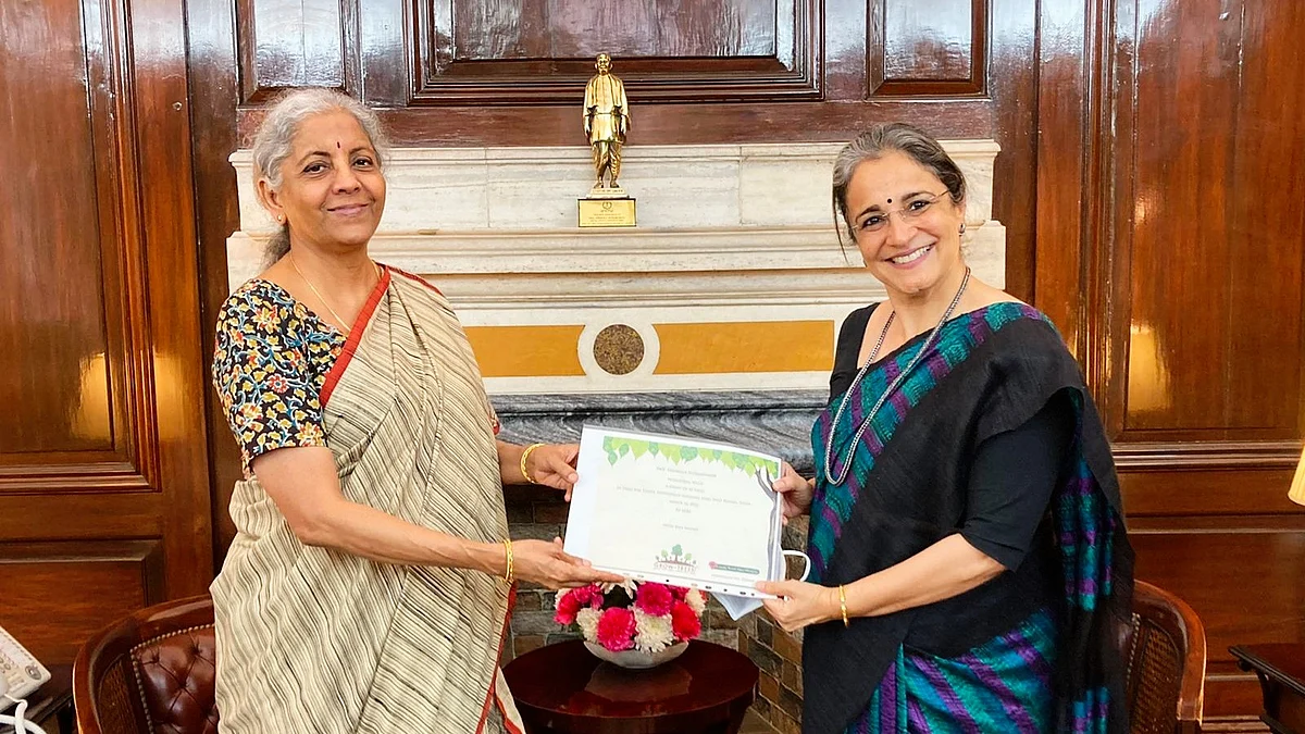 The SEBI chief (right) with finance minister Nirmala Sitharaman (file photo)