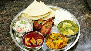 Why was a class 3 student suspended for bringing non-veg food to school?