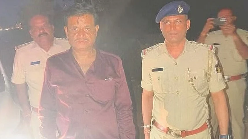 BJP MLA Munirathna in police custody (photo: @HateDetectors/X)