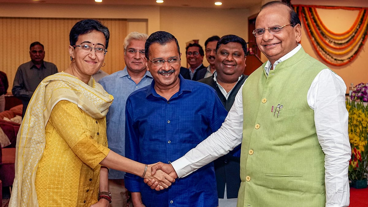 LG Vinai Kumar Saxena greets Atishi in New Delhi on 17 September (photo: PTI)