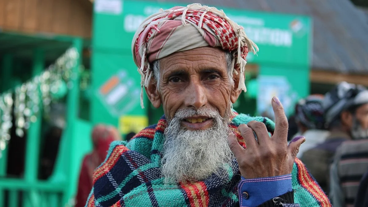 J&K Voter showing off their ink-marked fingers after casting vote