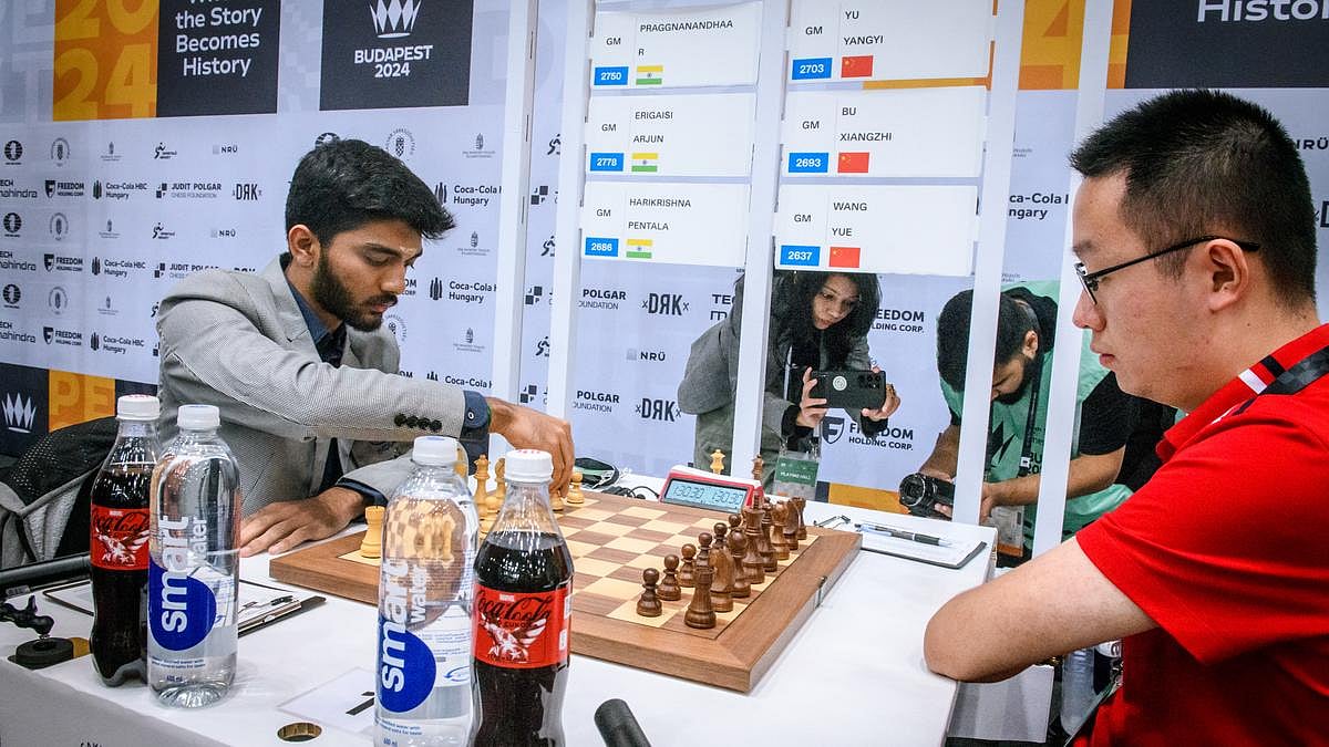 Gukesh D (left) makes his move against China's Wei Yi (photo courtesy: FIDE)