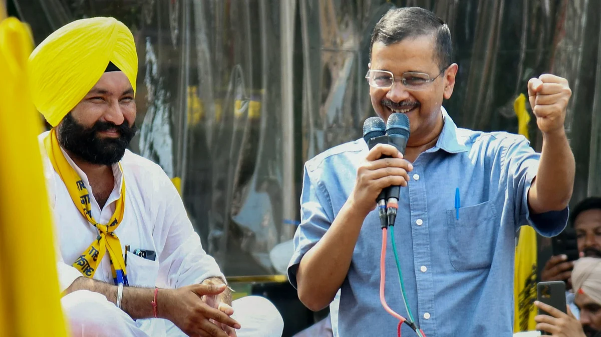 Arvind Kejriwal addresses the crowd during a roadshow in support of Harpinder Singh