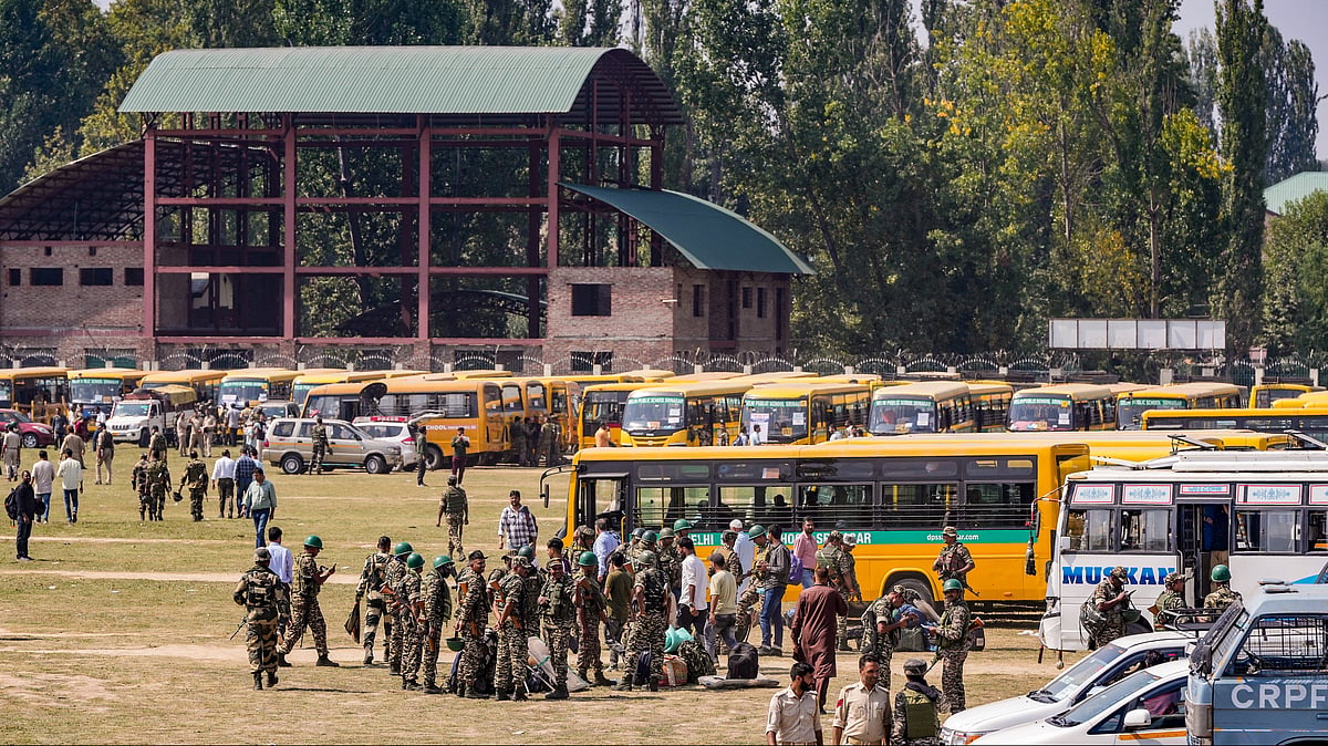 Security personnel prepare to leave for polling stations in Srinagar on 24 September (photo: PTI)