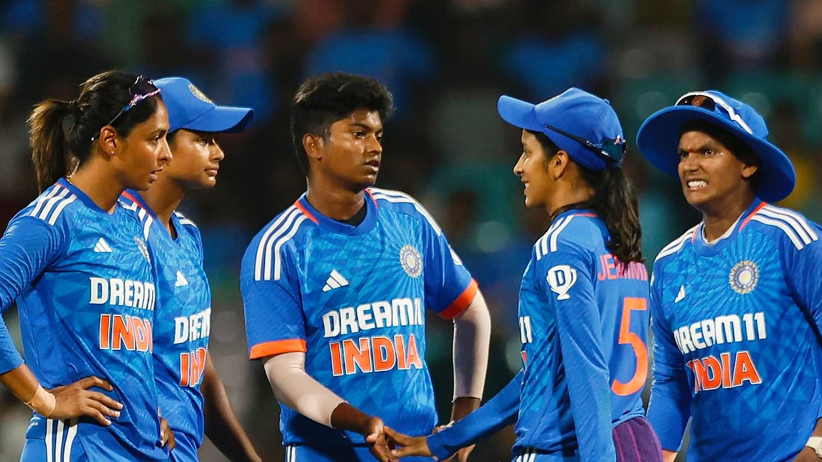 Indian women's team in a huddle with skipper Harmanpreet Kaur on the left