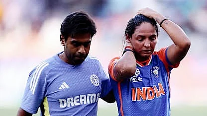Harmanpreet Kaur, India captain, being escorted off the field after a freak neck injury on Sunday