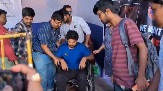 Dr Alok Varma (on wheelchair) being taken to hospital, 12 Oct 2024