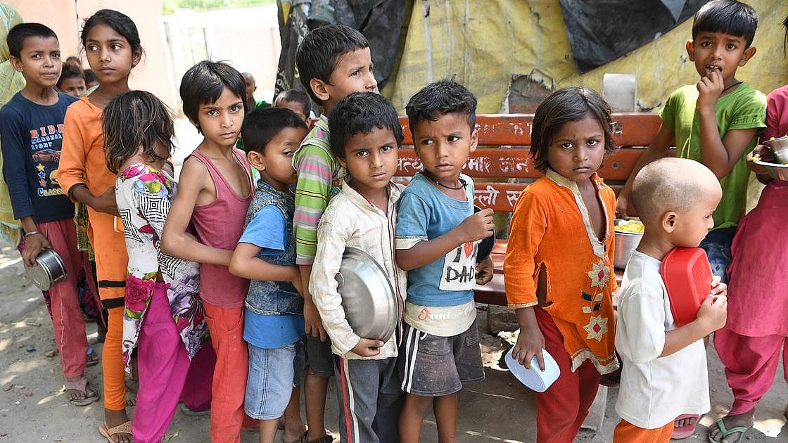 Hungry children at a free food distribution camp in Delhi