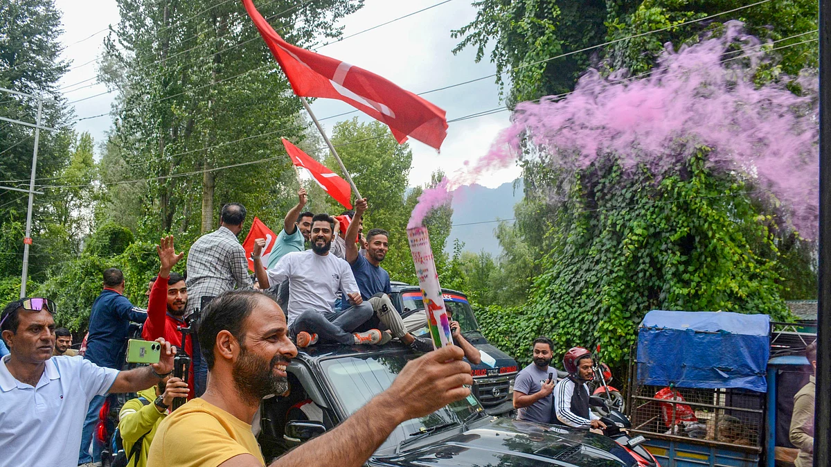 National Conference supporters celebrate the party's win (photo: PTI)