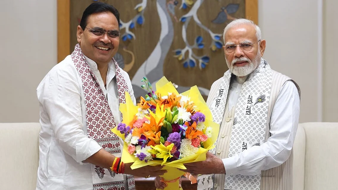 Remote control? Bhajanlal Sharma with PM Modi (photo: @bhajanlalbjp/X)