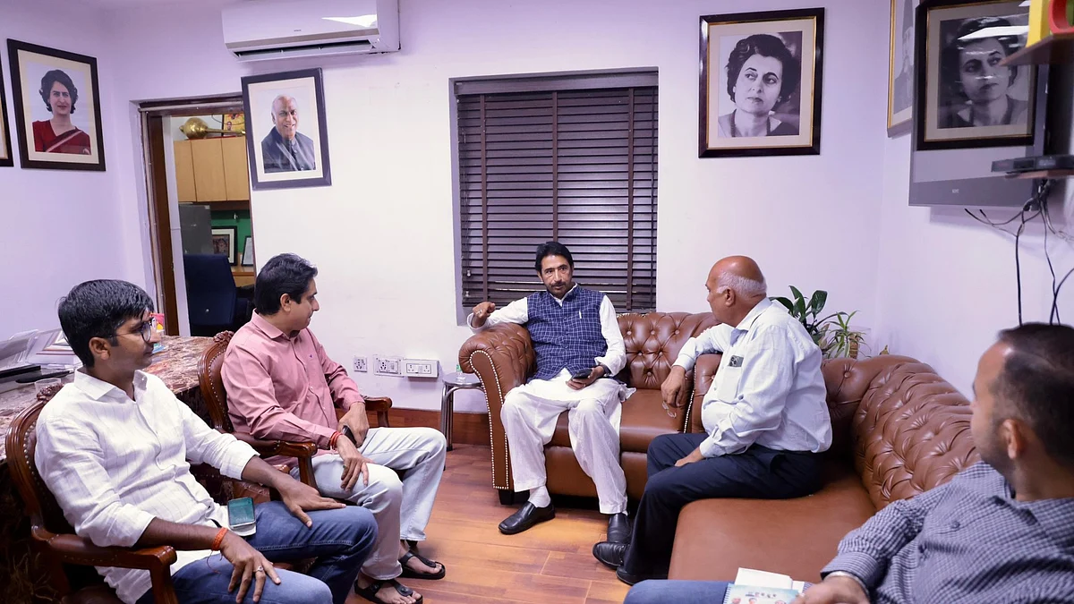 Ghulam Ahmad Mir (centre, blue waistcoat) at an IYC meeting 