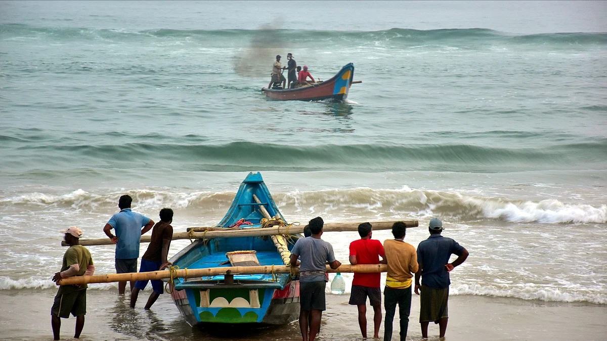 Fishermen prepare to leave the coast in Puri on 21 October (photo: PTI)