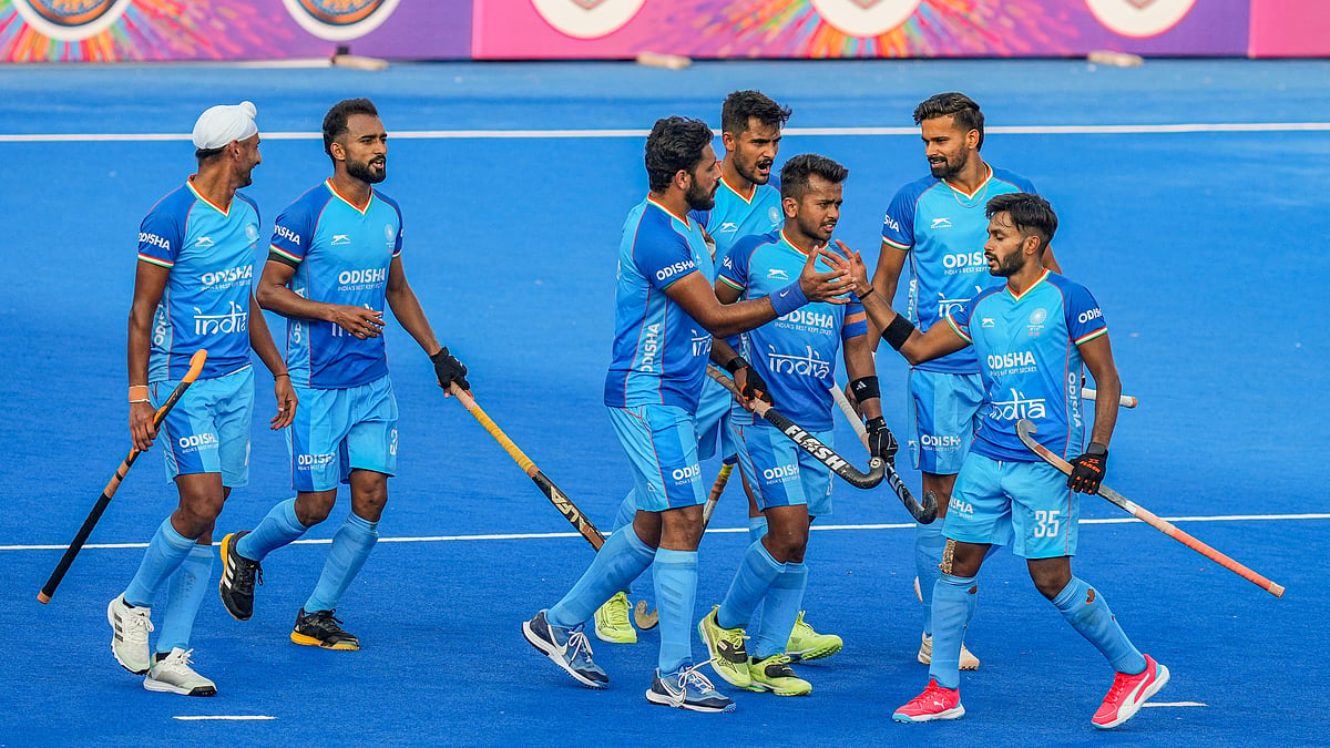 India celebrates after scoring a goal during the second men's hockey match