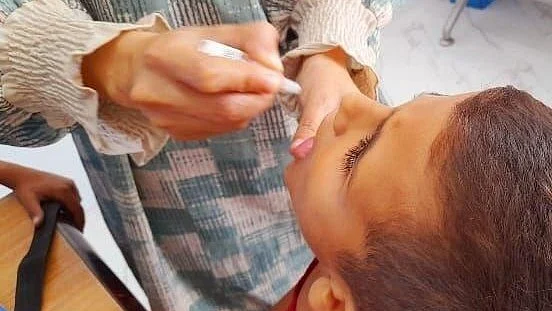 File photo of a child in Gaza being administered the vaccine