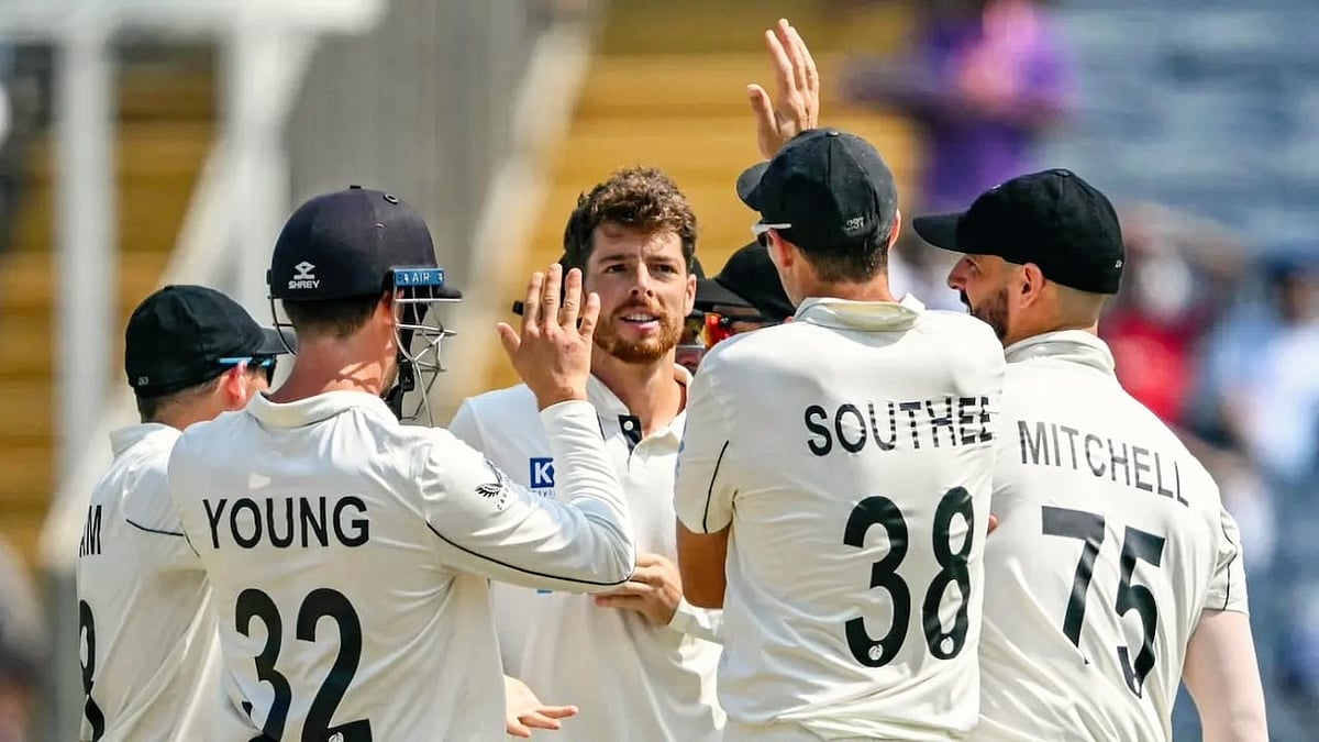 Mitchell Santner (facing camera) picked up 13 wickets to be player of the match