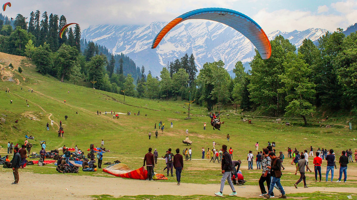 Tourists paragliding at Solang Valley in Manali, June 2024