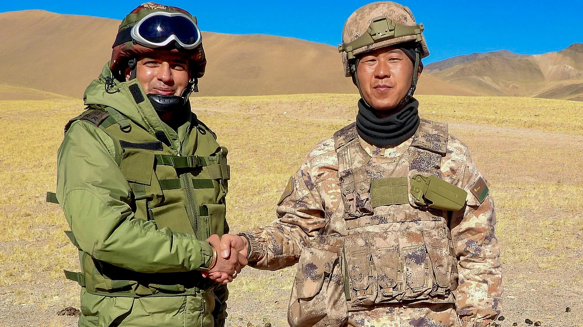 Indian and Chinese personnel exchange sweets on Diwali at Kongkla, LAC (photo: PTI)