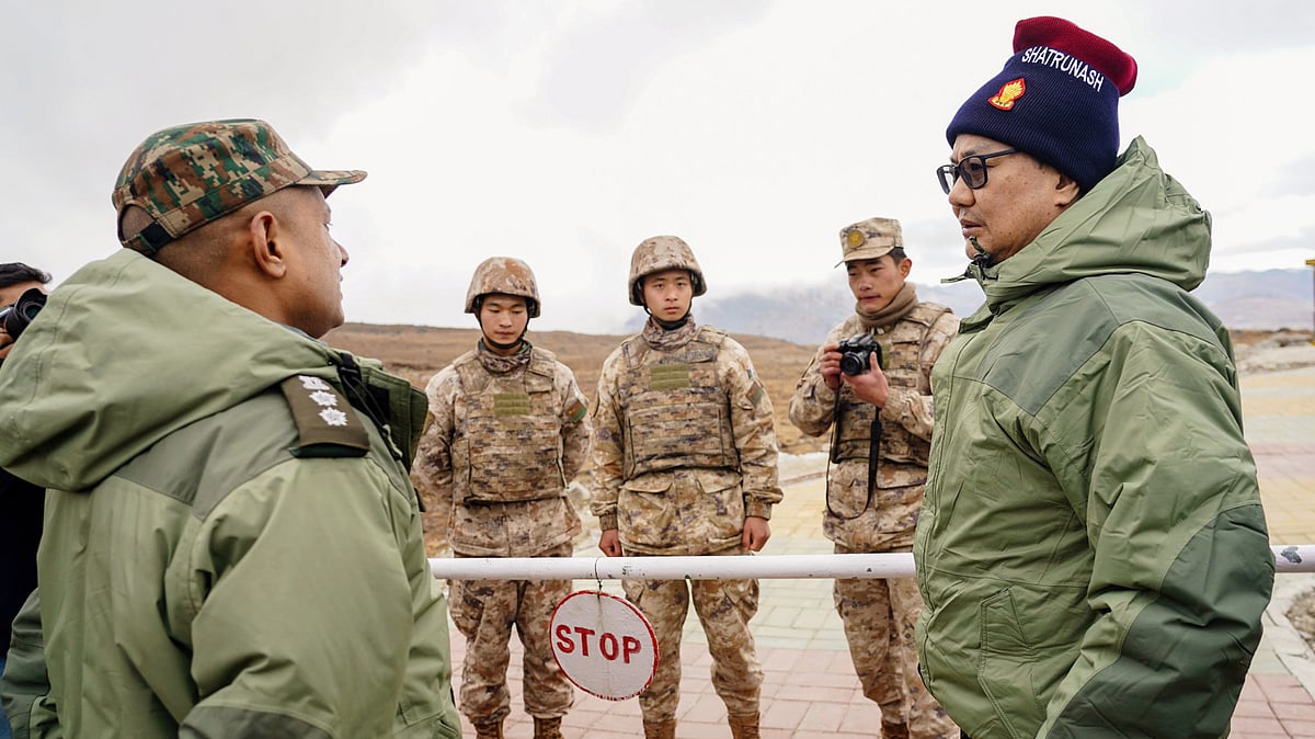 Rijiju interacts with Chinese soldiers near Tawang