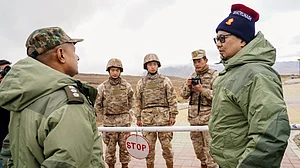 Rijiju interacts with Chinese soldiers near Tawang