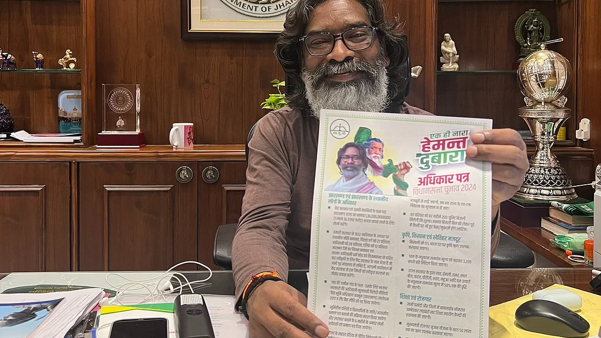 Hemant Soren at his desk with the JMM poll manifesto for the Jharkhand assembly election 2024