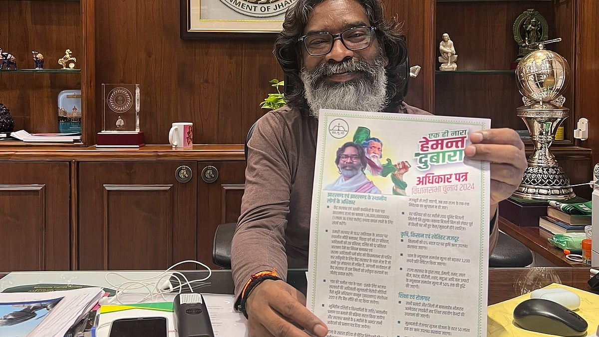 Hemant Soren at his desk with the JMM poll manifesto for the Jharkhand assembly election 2024