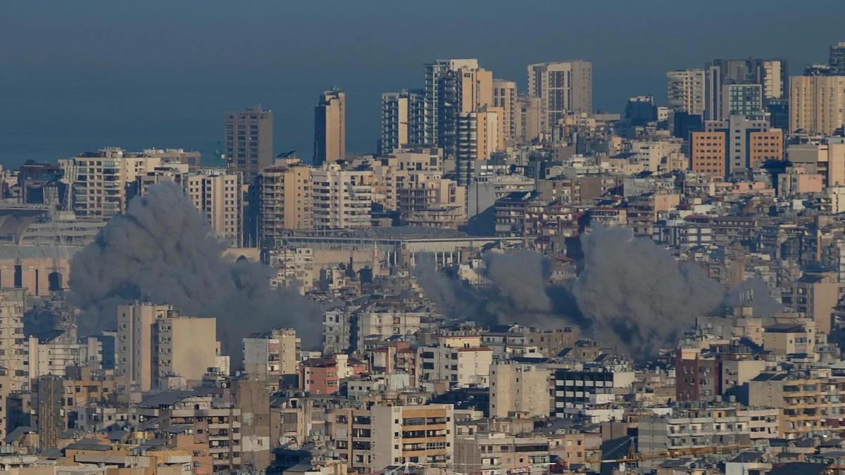 Smoke rises between buildings after an Israeli airstrike in Lebanon on 15 November (photo: PTI)