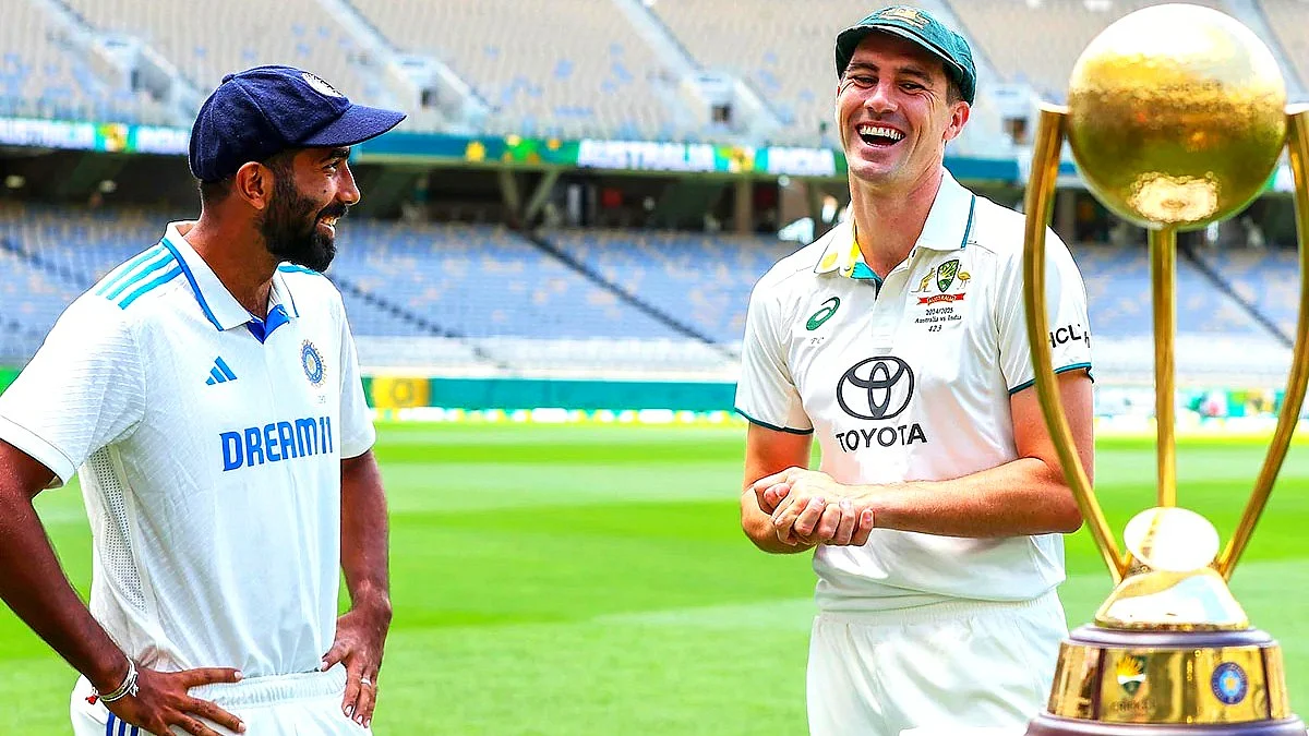 Jasprit Bumrah and Pat Cummins with the trophy (courtesy: ICC)