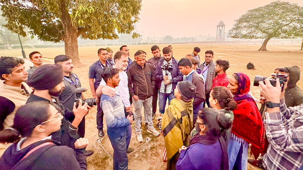 Rahul Gandhi meets local residents in New Delhi on 22 November (photo: PTI)