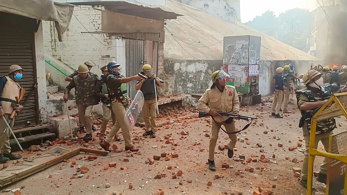 Policemen in action during the violence in Sambhal on 24 November (photo: PTI)