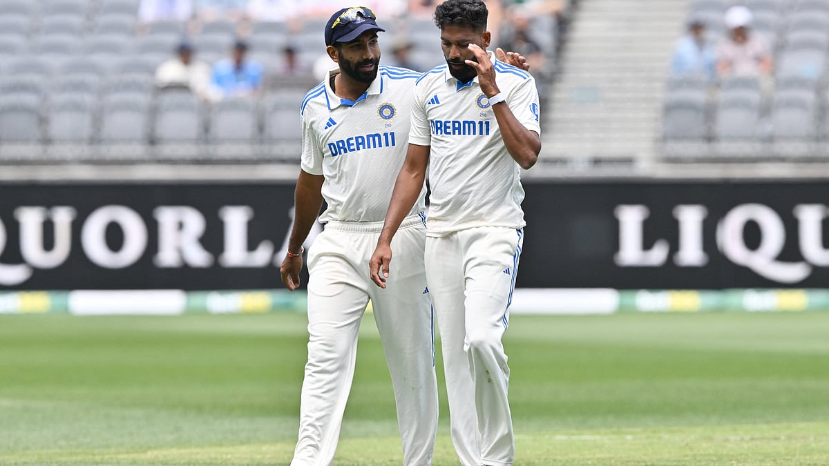 Captain Jasprit Bumrah calms Mohammed Siraj down during the Perth Test (photo: X/BCCI)