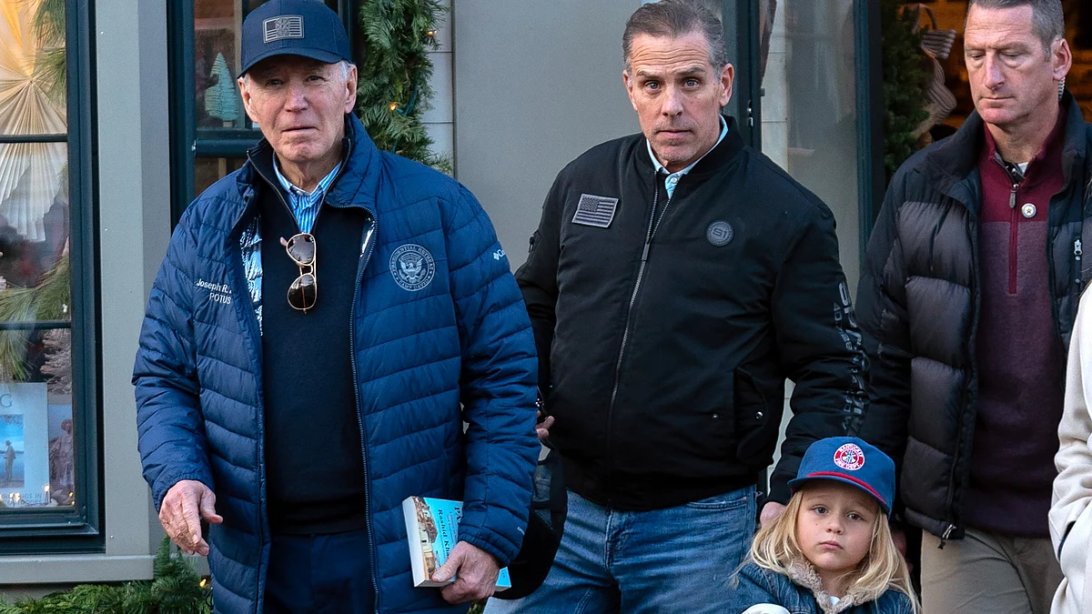 Joe Biden with his son Hunter in downtown Nantucket Mass. on 29 November (photo: PTI)