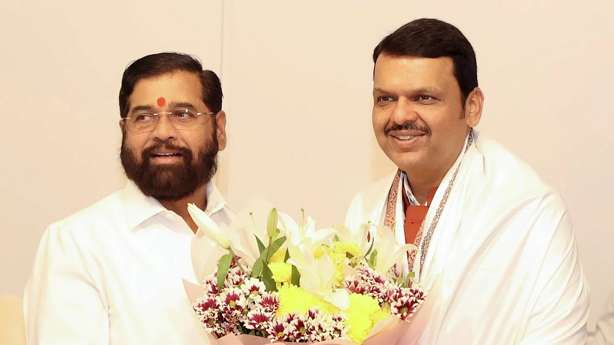 Maharashtra chief minister-designate Devendra Fadnavis with Shiv Sena leader Eknath Shinde (left)