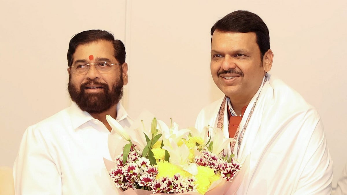 Maharashtra chief minister-designate Devendra Fadnavis with Shiv Sena leader Eknath Shinde (left)